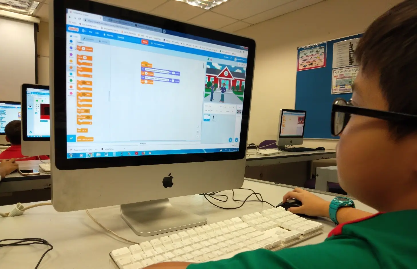 child-creating-a-project-on-scratch-coding